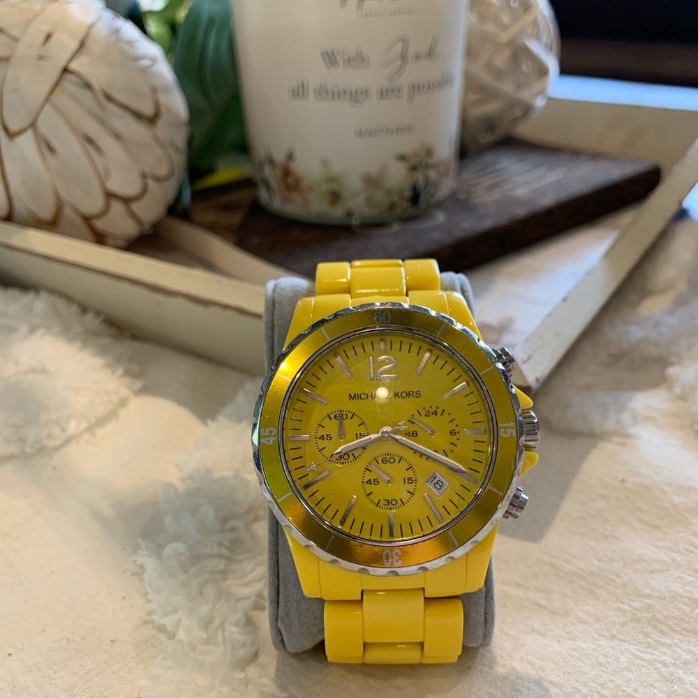 Men’s Yellow Michael Kors watch.